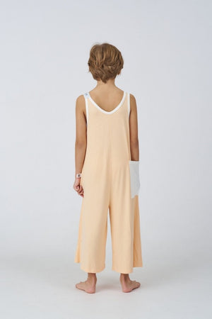 Kids Bamboo Jumpsuit in Peach, back view - Awakind.co