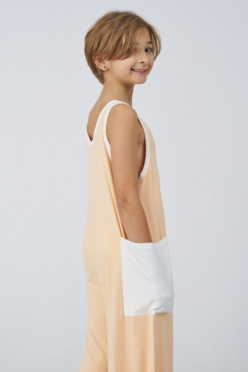 Kids Bamboo Jumpsuit in Peach, side view with pocket - Awakind.co