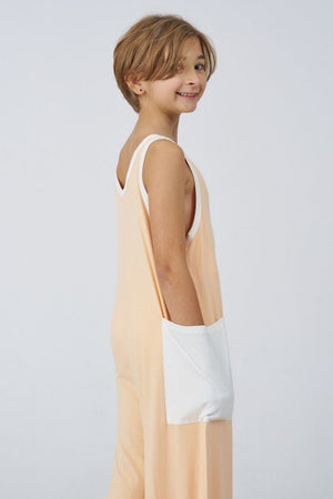 Kids Bamboo Jumpsuit in Peach, side view with pocket - Awakind.co