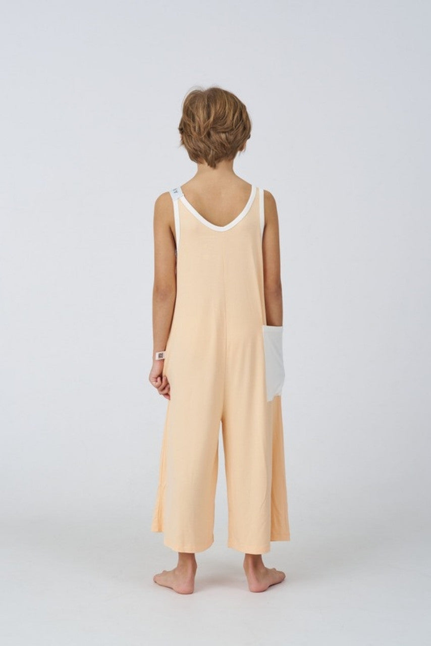 Kids Bamboo Jumpsuit in Peach, back view - Awakind.co